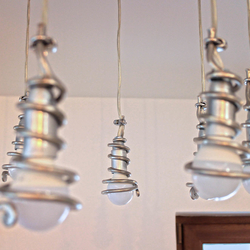 The detail of aluxury pendant lighting  Amodern chandelier with handcrafted spirals