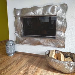 Amodern stainless steel fireplace and afirewood rack  hand forged in the Artistic Smithery UKOVMI