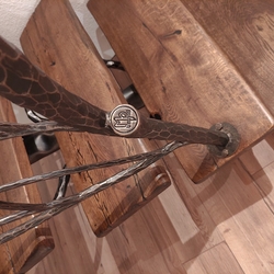 Detail of ahand forged luxury railing with the logo of the Atelier of Artistic Smithcraft  UKOVMI