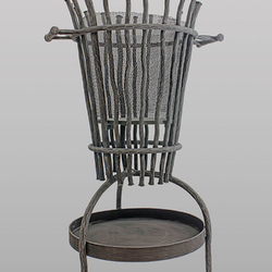A hand forged fire basket