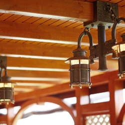 Wrought iron lighting in a summer house