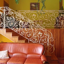 An exceptional interior staircase railing - A white railing with gold-green patina