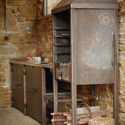 A wrought iron fireplace set A wrought iron fireplace set
