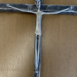 A sculpture of Christ on a forged cross - religious objects