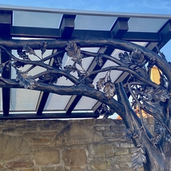 Tree branches under the canopy - blacksmith's works of art