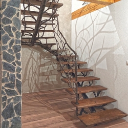 High quality hand forged staircase with railing, styled as tree branches