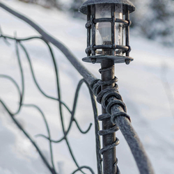 A wrought iron railing with built-in lights 