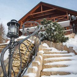 A hand wrought iron railing with built-in lights