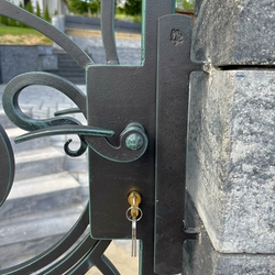 Wrought iron handle on the gate Wrought iron handle on the gate