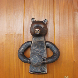 A wrought iron knocker - bear