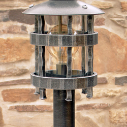 A wrought iron standard lamp Historical - a garden lamp