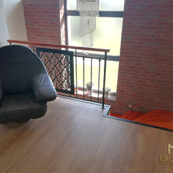 A wrought-iron interior railing in a family house made in industrial style