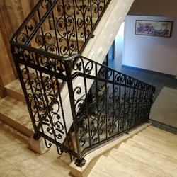 An exclusive railing forged in UKOVMI for an interior staircase in an apartment hotel An exclusive railing forged in UKOVMI for an interior staircase in an apartment hotel