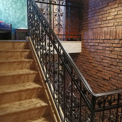A luxury forged railing - staircase in an apartment hotel - interior railings A luxury forged railing - staircase in an apartment hotel - interior railings