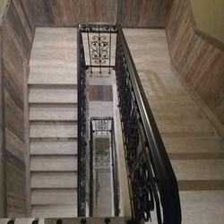 A multistorey interior railing in an apartment hotel - luxury wrought-iron railing from UKOVMI