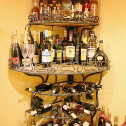 A wrought iron rack - wine holder