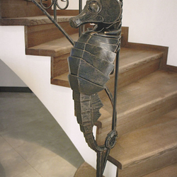 A wrought iron seahorse - a handrail detail A wrought iron seahorse - a handrail detail