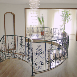 A curved wrought iron railing - interior railing A curved wrought iron railing - interior railing