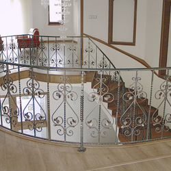 A curved wrought iron railing A curved wrought iron railing