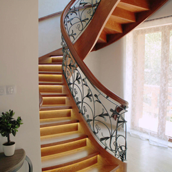 Spiral wrought iron railings combined with wood - Lily pattern Spiral wrought iron railings combined with wood - Lily pattern