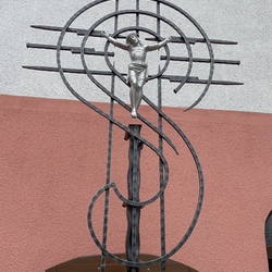 A wrought iron cross near the House of Peaceful Old Age in Lipany - Slovakia A wrought iron cross near the House of Peaceful Old Age in Lipany - Slovakia