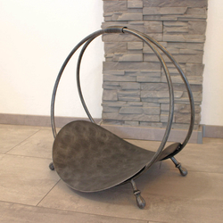 A high quality firewood rack – a circular firewood rack in silver patina A high quality firewood rack – a circular firewood rack in silver patina