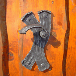 A wrought iron handle - bark A wrought iron handle - bark