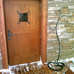 A wrought iron door grille and a hanger