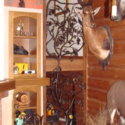A wrought iron grille in a hunter's cabin