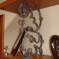 A wrought iron shelf