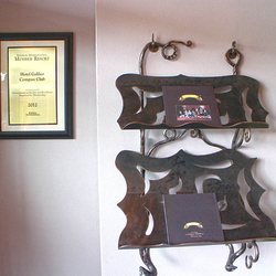 A wrought iron magazine rack