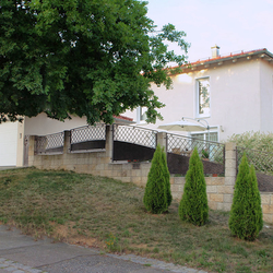 A wrought iron fencing - a family house