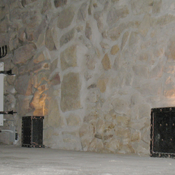 Wrought iron lighting in a wine cellar