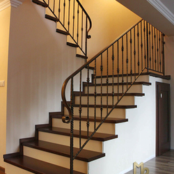 A wrought iron railing - simple railing in a family home A wrought iron railing - simple railing in a family home