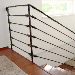 A wrought iron stair railing - Knot pattern A wrought iron stair railing - Knot pattern