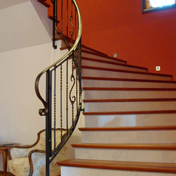 A spiral wrought iron stair railing A spiral wrought iron stair railing