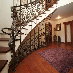 A curved wrought iron railing - entrance gate and stairs A curved wrought iron railing - entrance gate and stairs
