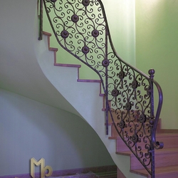 A wrought iron stair railing A wrought iron stair railing