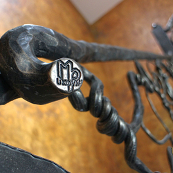 Hand wrought iron interior staircase railing - Roots - a detail Hand wrought iron interior staircase railing - Roots - a detail