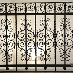 A wrought iron railing in a historical building from the 15th century A wrought iron railing in a historical building from the 15th century