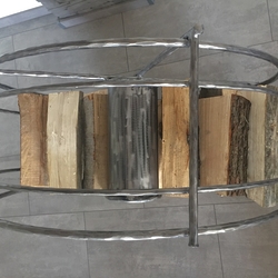 A forged wheel-shaped log holder – an original storage space for wood – view from above