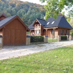 Overall front view of the forged fence at the cottage - vintage design