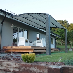 Wrought iron roofing of the terrace of a family house in a modern style