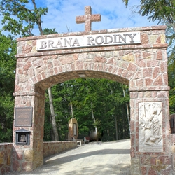 The gate of the family at the pilgrimage place Butkov in Slovakia  forged inscription and a board from UKOVMI