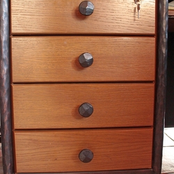 Quality forged handles on drawers of an office desk – wrought-iron furniture