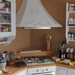 A kitchen wrought iron cooker hood