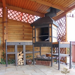 A wrought iron fireplace set A wrought iron fireplace set