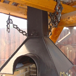A wrought iron fireplace set A wrought iron fireplace set