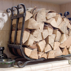 A wrought iron firewood rack