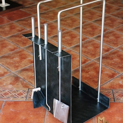 Modern stainless steel tools and a firewook rack Modern stainless steel tools and a firewook rack